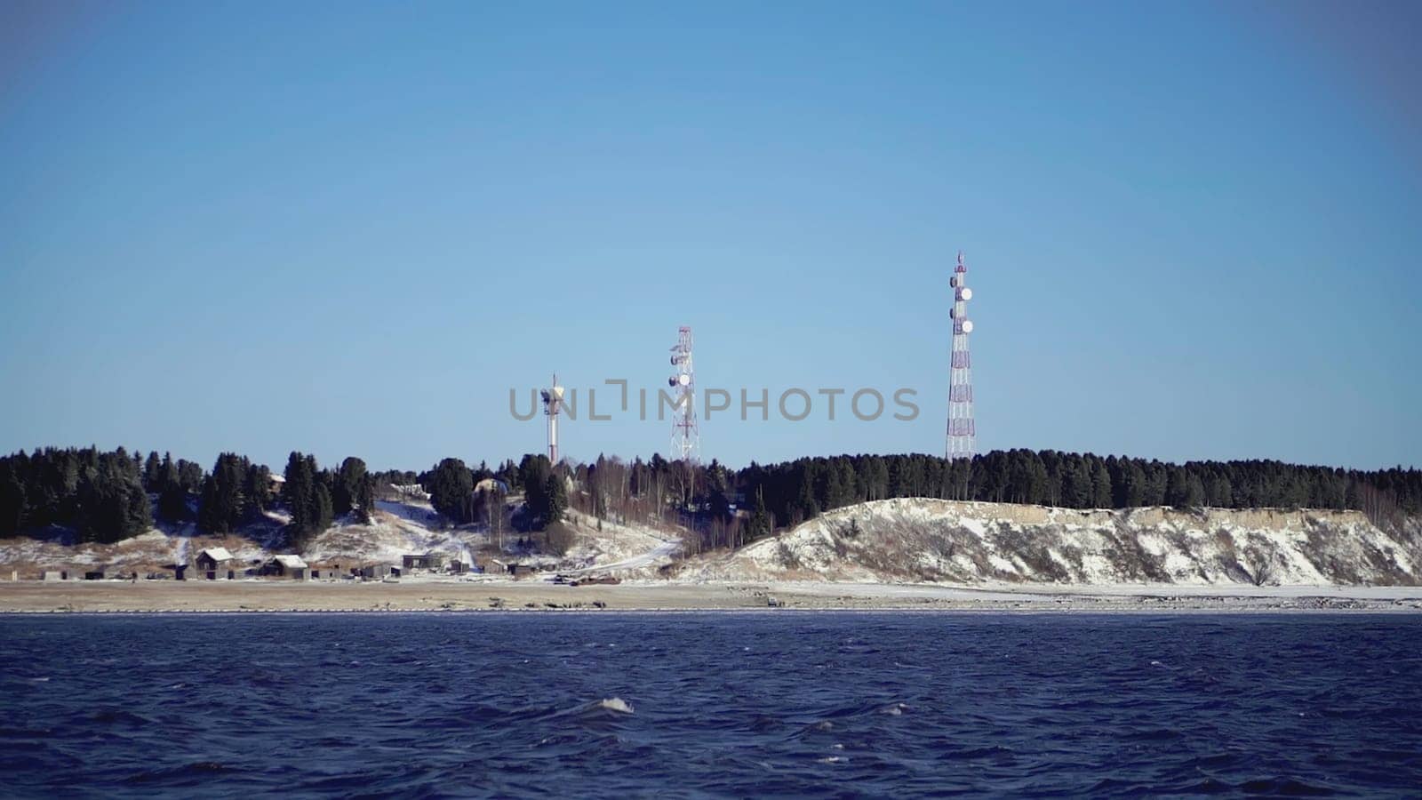 The seashore by which the ship sails. CLIP. View from the ship to the rocky shore where the cell towers are located.