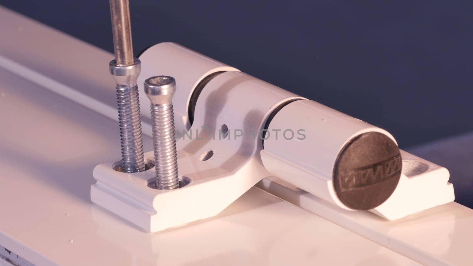 Installation Accessories For Plastic Pvc Windows. Screwdrivers or Drill. Male Hands Fasten Window Handle By Electric Screwdriver. Tempered float glass panels. Industry