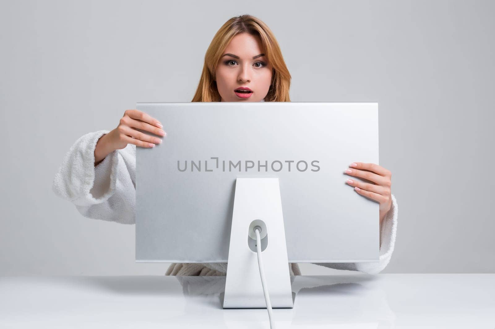young woman sitting in the table and using computer by nazarovsergey