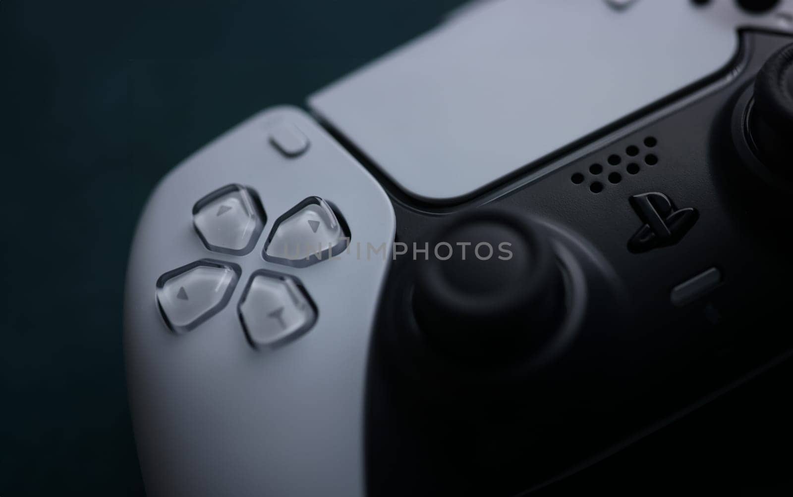 Control buttons on sony playstation 5 game controller closeup by kuprevich