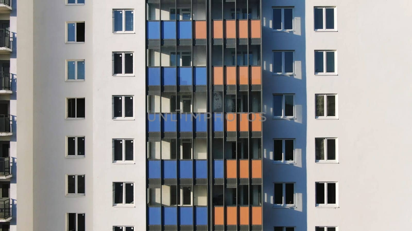 Close-up view facade of the beautiful colorful of a tall residential building. High-rise buildings modern architecture skyline.