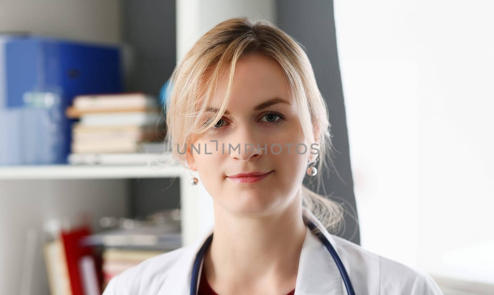 Beautiful smiling female doctor at workplace portrait. Physical and disease prevention patient aid exam visit 911 ward round prescribe remedy healthy lifestyle consultant profession concept