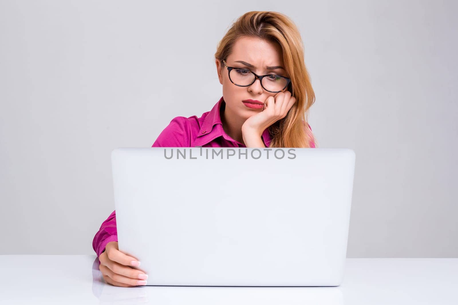 Young businesswoman working at laptop computer. she was tired and looking at monitor