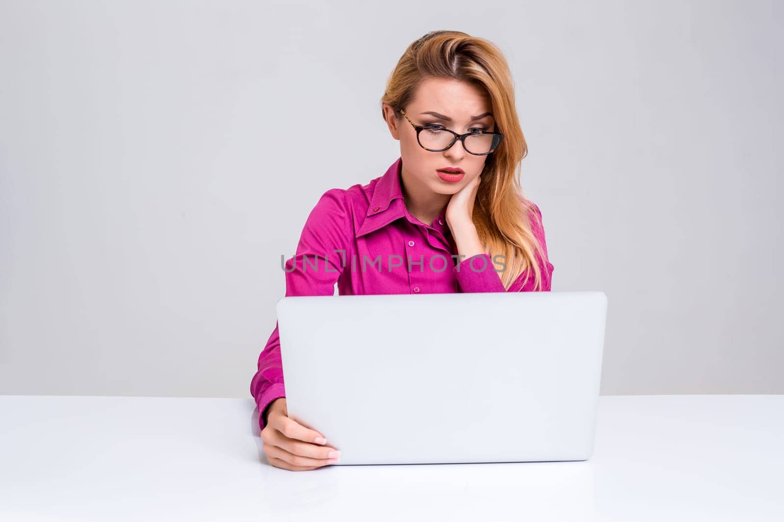 Young businesswoman working at laptop computer. she was tired and looking at monitor