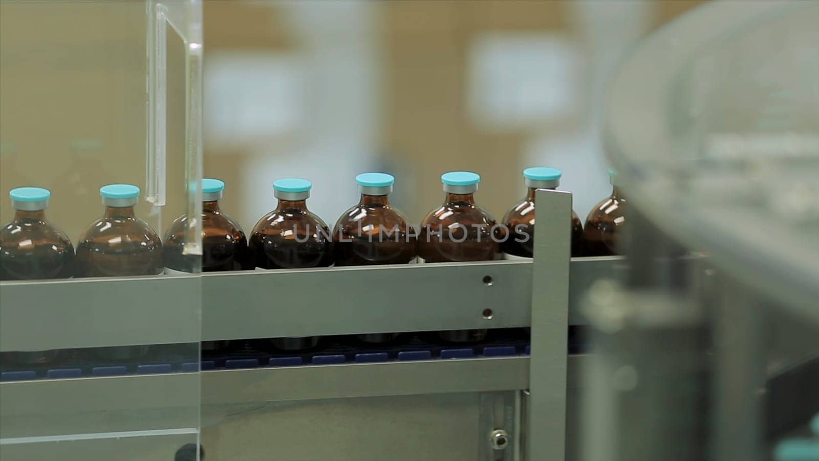 Pharmaceutical industry. Production line machine conveyor at factory with bottles. pharmaceutical production of liquid pharmaceuticals HD