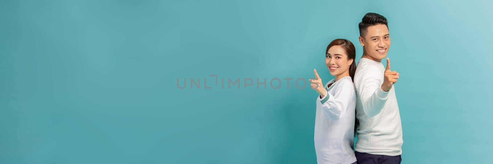 Asian young spouses couple pointing at camera, choosing you for new opportunities, challenge