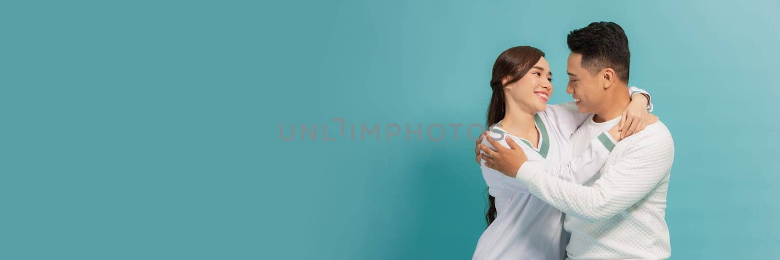Her Prince Charming. Portrait of a young couple embracing isolated on a white background and embracing.