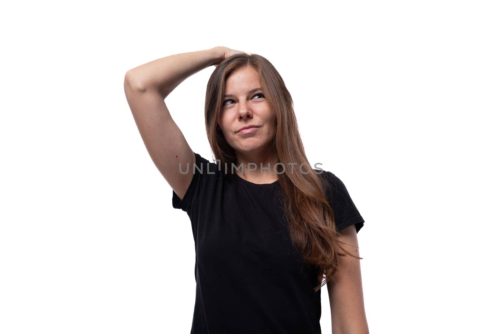 Close-up portrait of a slim cute woman dressed in basic casual clothes.