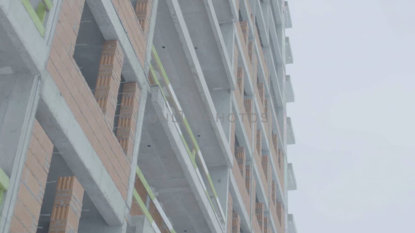 Facade of a modern apartment building. Construction of apartment buildings.