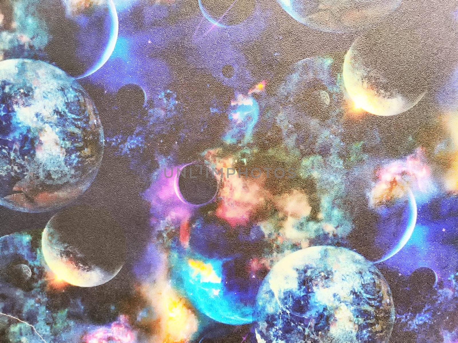 Wallpaper with pattern of galaxies, stars, planets. Textured paper, pattern, background