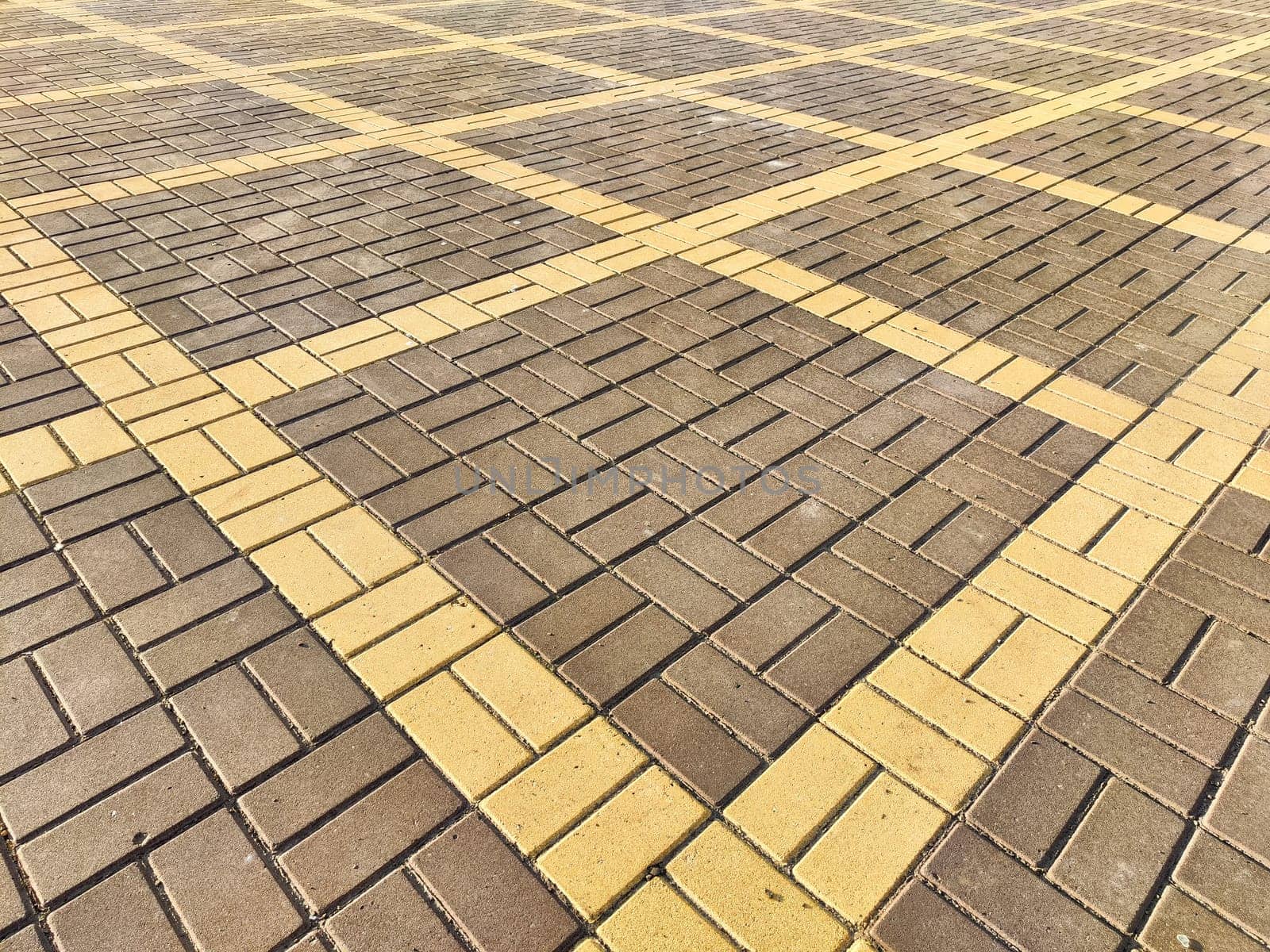 paving stone tiles of square and rectangular shape of gray in perspective. Close up road surface. Abstract Background, texture, frame, place for text and copy space