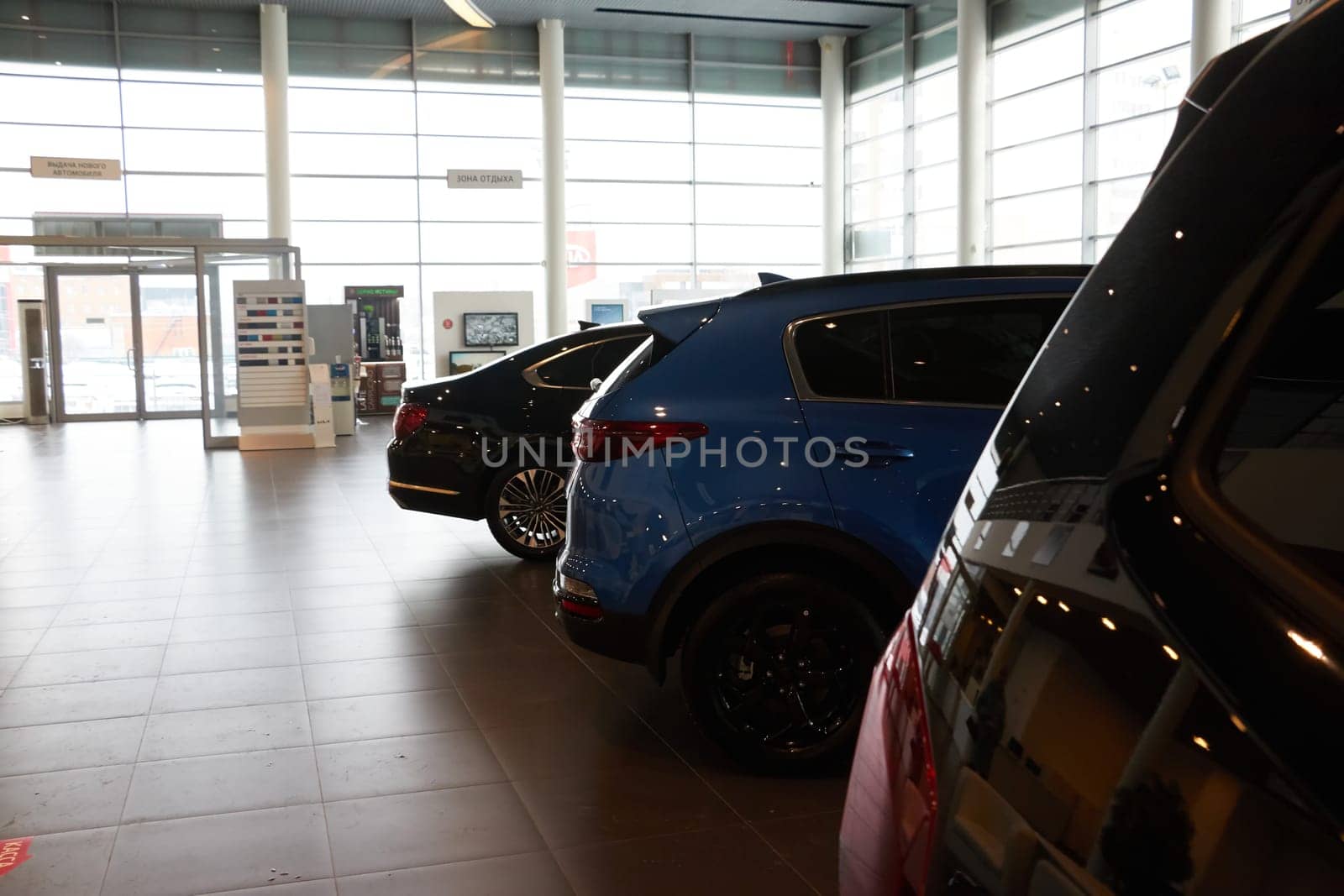 Kazan, Russia - November 25, 2022: Cars in showroom of dealership Kia in Kazan in Russia. Partial focus