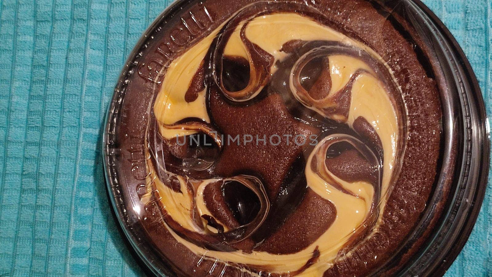 chocolate cake sponge cake with yellow cream, dessert sweets food. High quality photo