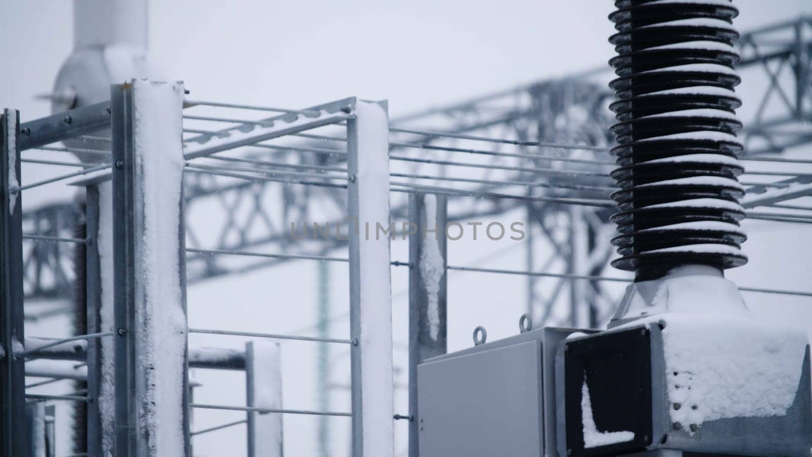 Switchgears and switches in a power plant with steel structure. Power plant detail, high voltage isolation. Voltage transformers at the power plant.