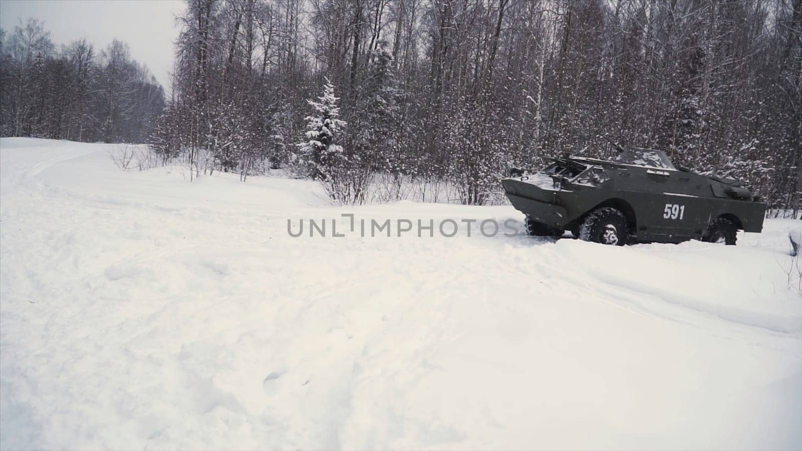 Throw a grenade in a military tank. Clip. Soldier throws a hand grenade into a battle tank or armored personnel carrier, winter backround, Soldier throws a training grenade into a tank in the winter forest. War concept.