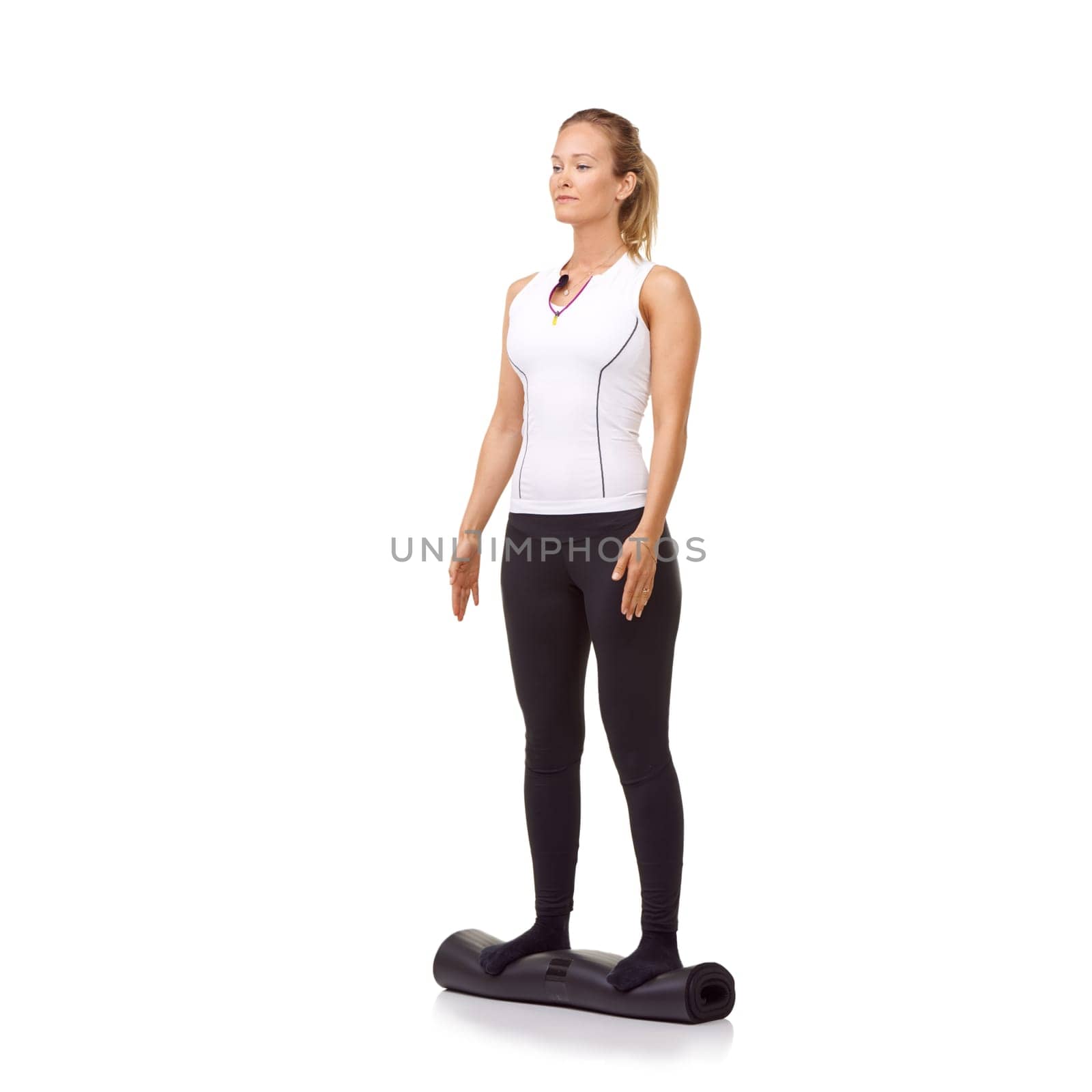 Woman, exercise and mat in studio for fitness, pilates or workout for healthy body, wellness or balance. Person, face and yoga in sportswear for physical activity on mock up space or white background.