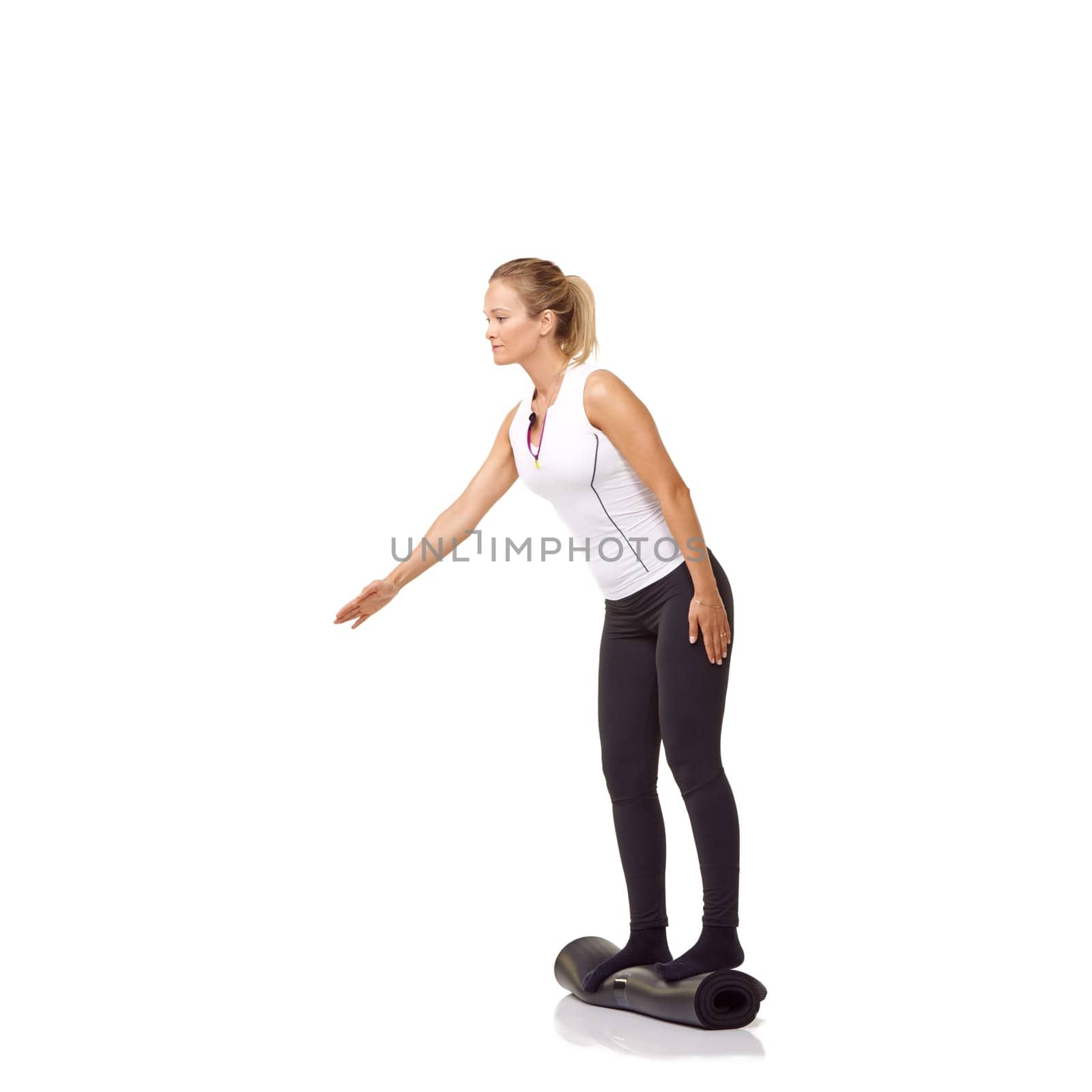 Woman, exercise and mat in studio for workout, pilates or fitness for healthy body, wellness or balance. Person, face and yoga in sportswear for physical activity on mock up space or white background by YuriArcurs
