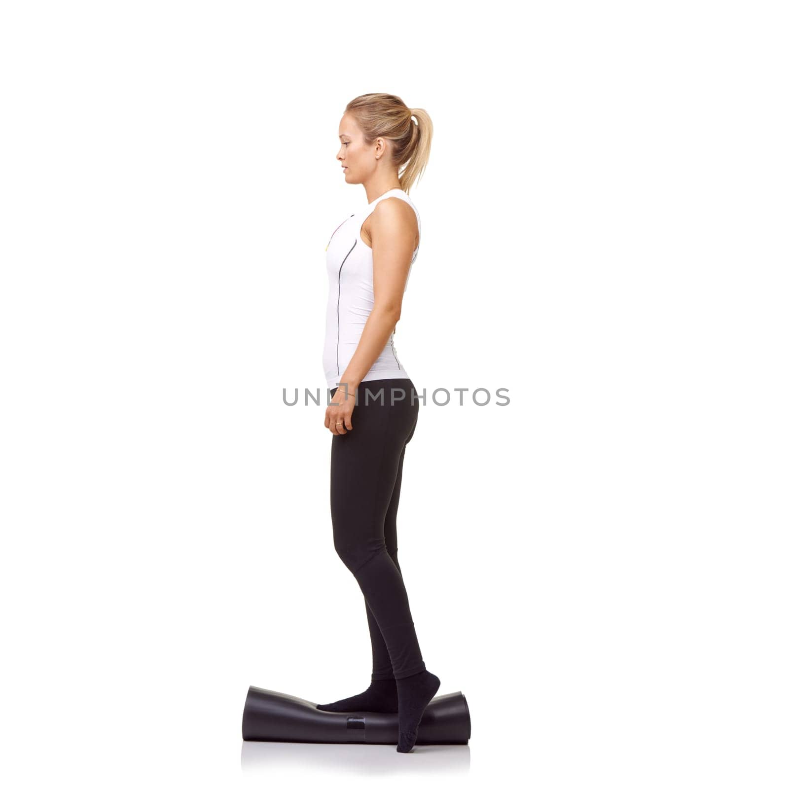 Woman, exercise and mat in studio for balance, pilates or workout for healthy body, wellness or fitness. Person, face and yoga in sportswear for physical activity on mock up space or white background.