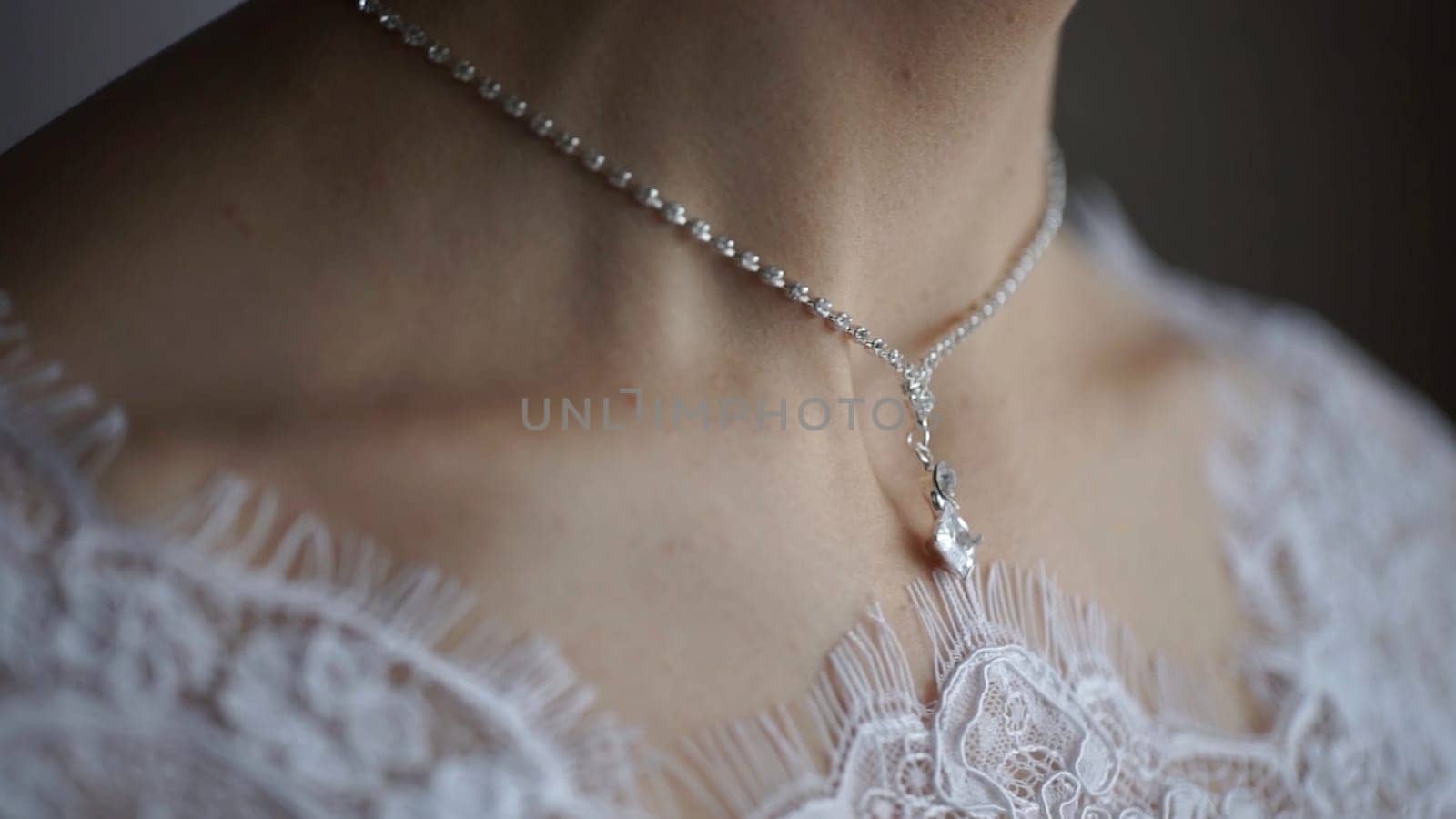 Wedding bracelet and necklace. Woman trying on jewelry bracelet. Bride with treasure. Woman with jewelry. Girl with fashionable jewelry, earrings, bracelets and necklace HD