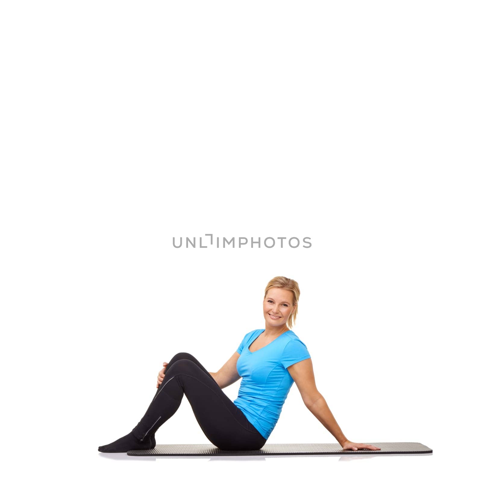 Woman, yoga and portrait on floor of studio for exercise, healthy workout and smile isolated on white background. Wellness, training and happy lady on mat for fitness, strong body and mockup space by YuriArcurs