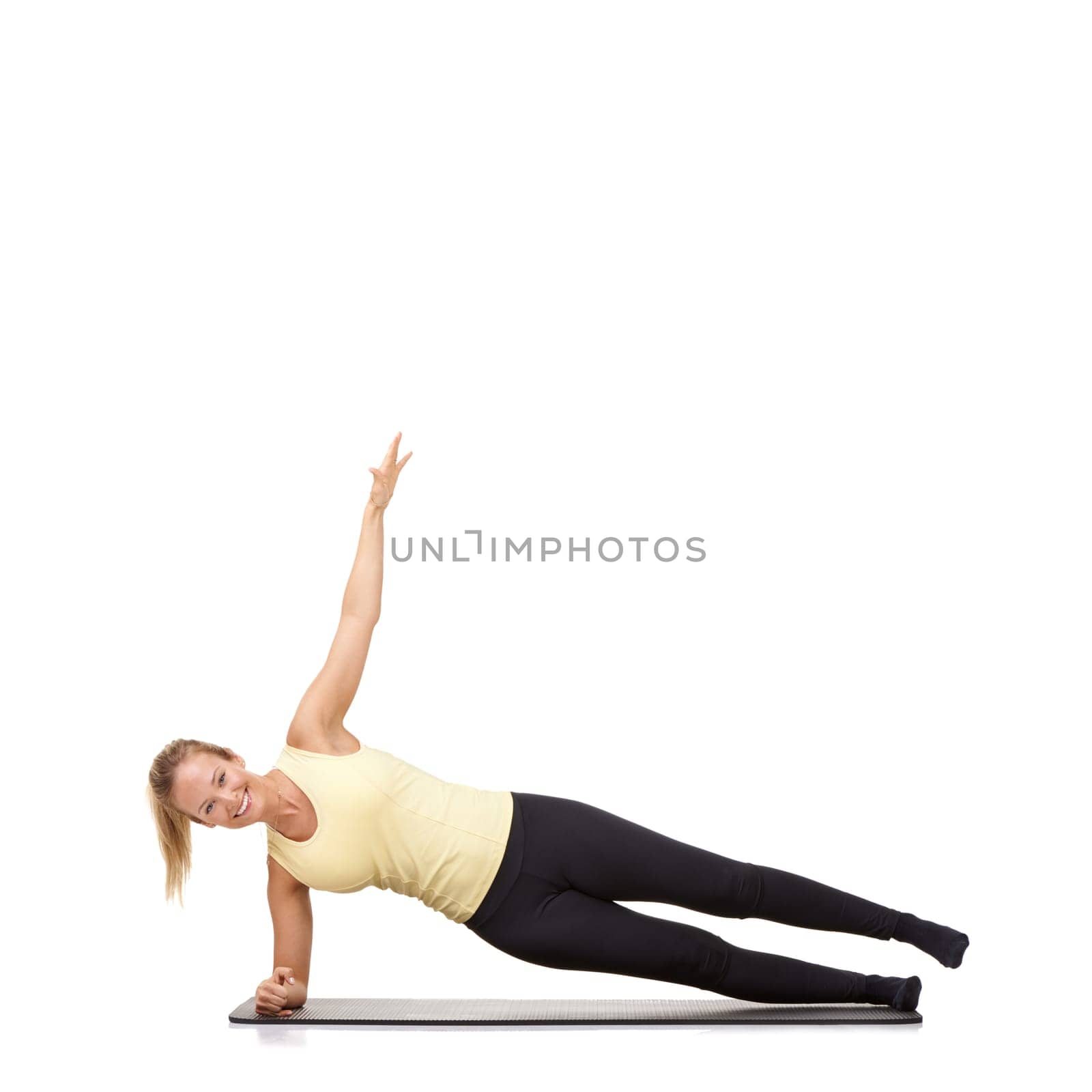 Woman, pilates and mat in studio for stretching, fitness or workout for healthy body, happy or core muscle. Person, portrait or yoga on floor for abdomen health on mockup space or white background by YuriArcurs