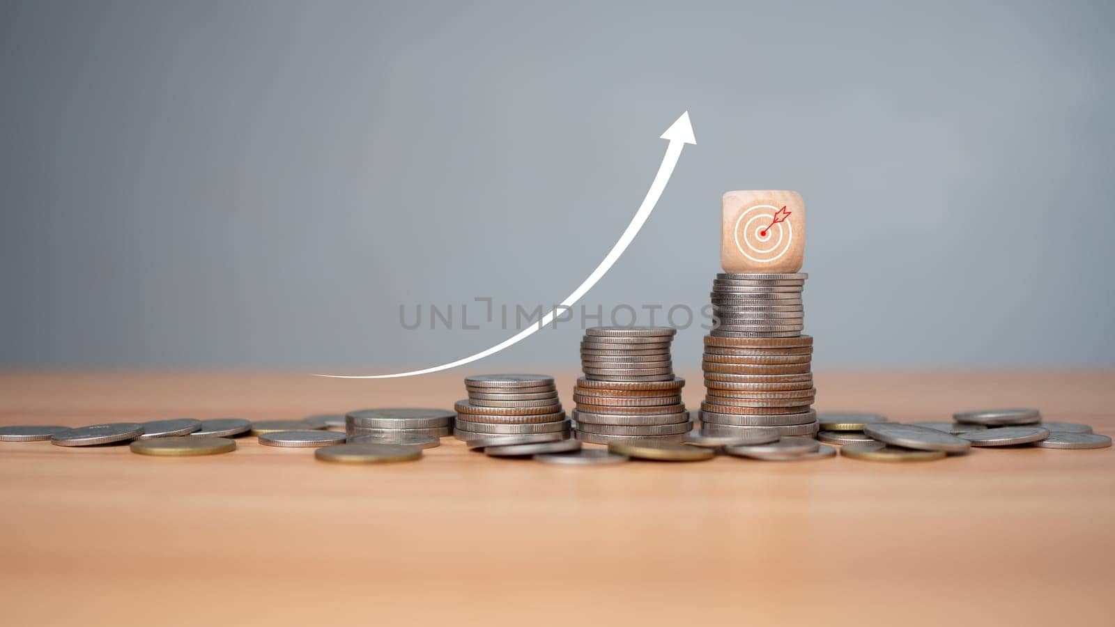 Inflation concept, white graph arrow, world economics, and inflation control, Money and budget management, dart board on a wooden cube with row of coins in idea for FED consider interest rate hike. by Unimages2527