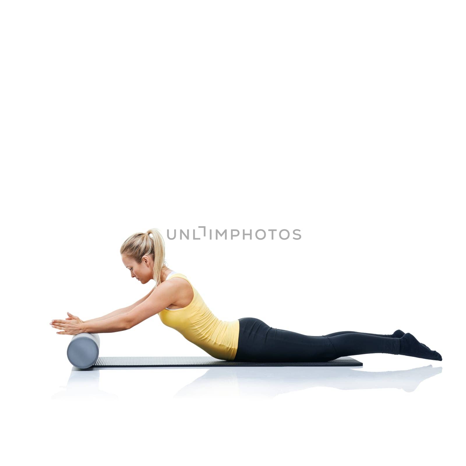 Pilates, foam roller and woman in a studio for workout, stretching or gym routine with yoga mat. Stability, balance and young female athlete from Australia with body exercise by white background. by YuriArcurs