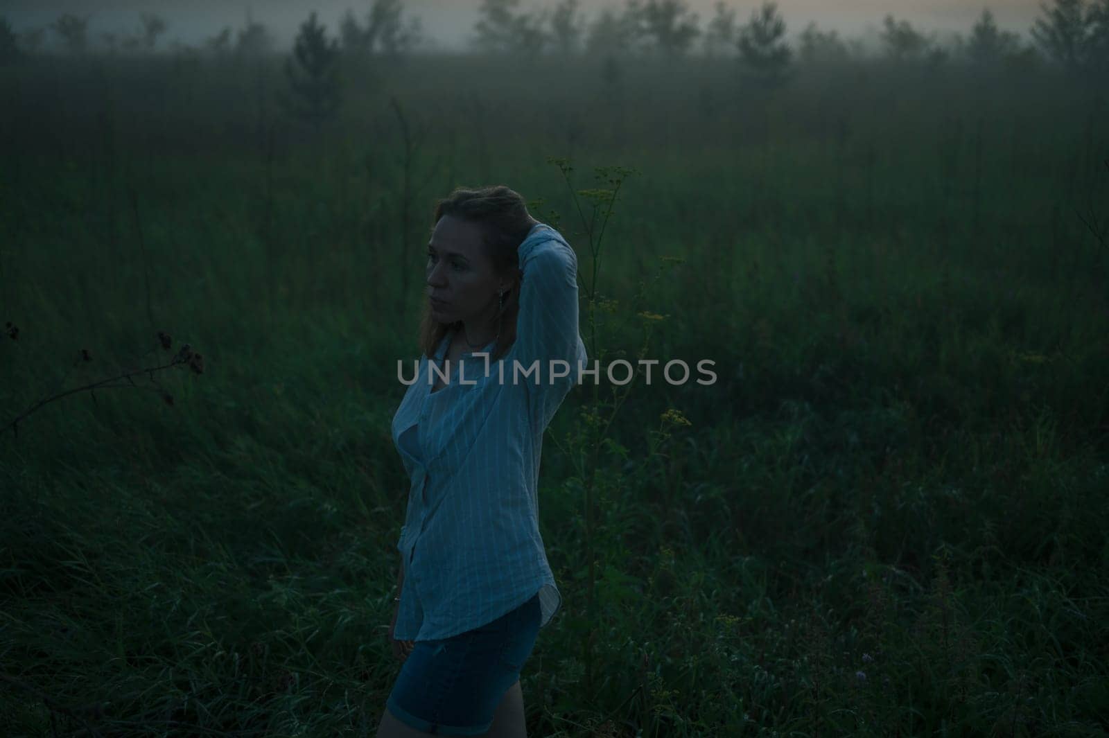 Woman in a field with fog by rusak