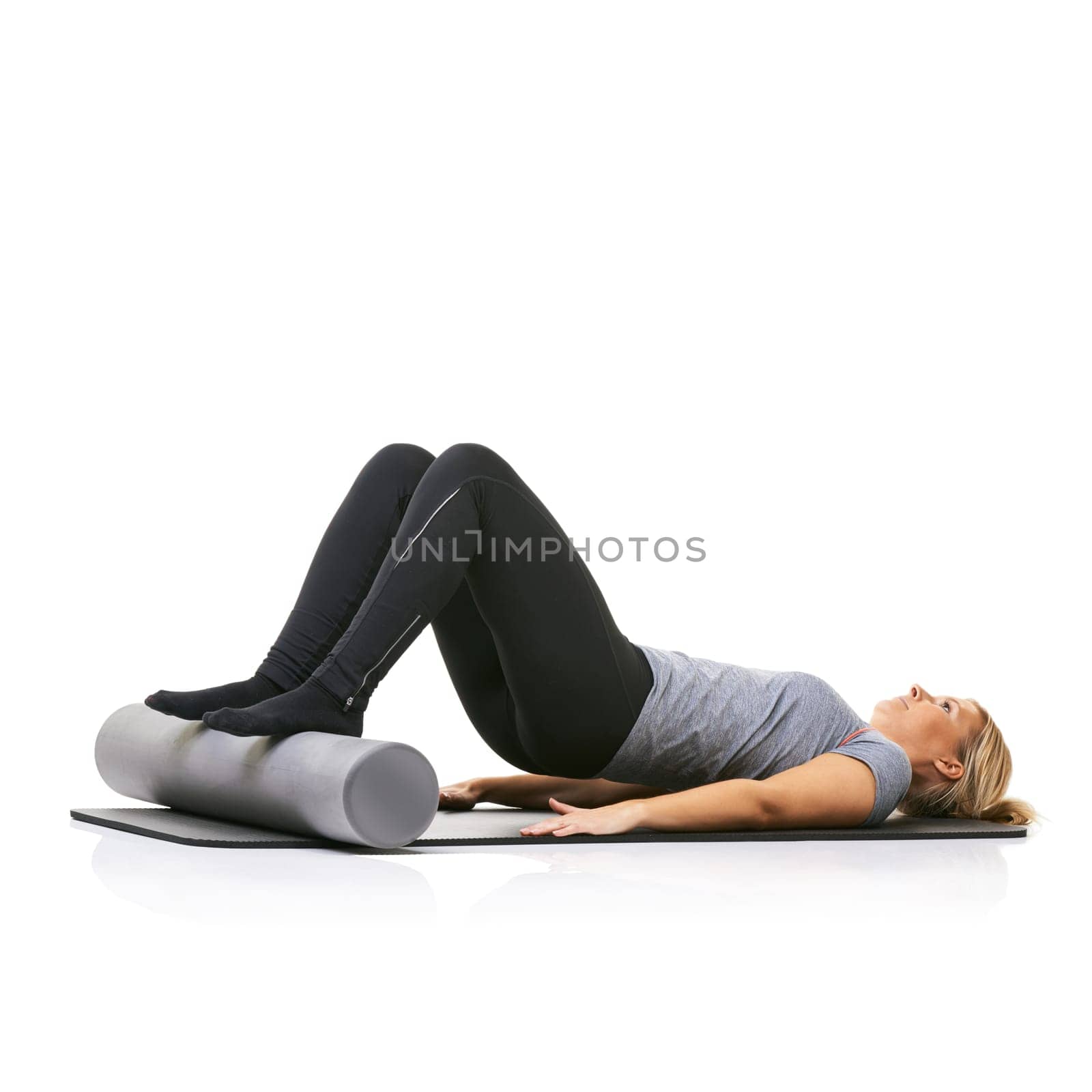 Core workout, foam roller and studio woman with bridge exercise, activity or wellness for sports performance on floor. Ground, mockup space and girl fitness, training and yoga mat on white background.