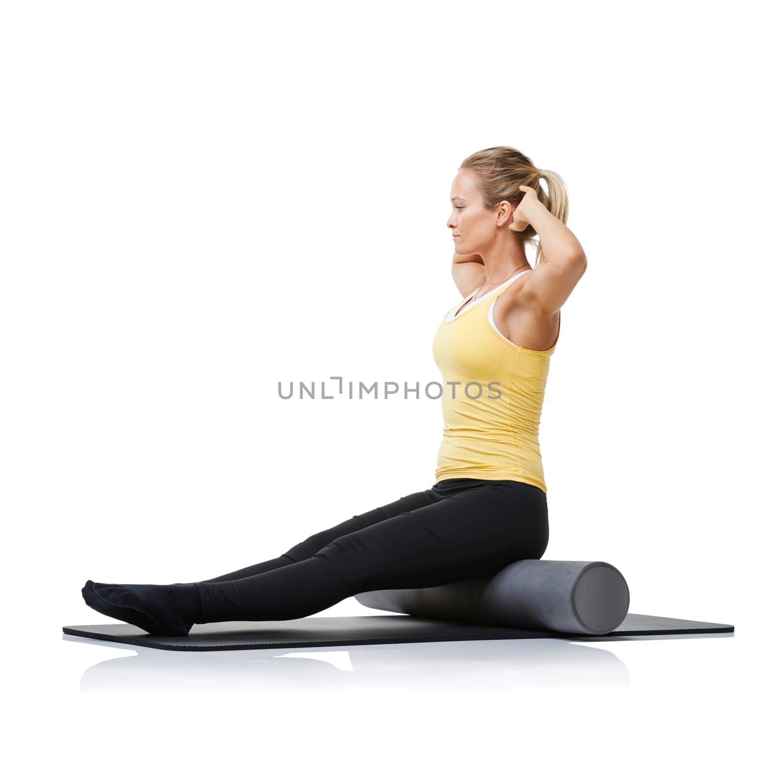 Studio fitness, foam roller and pilates woman with posture training, core wellness challenge or active stretching exercise. Ground, yoga mat and profile of physical activity girl on white background.