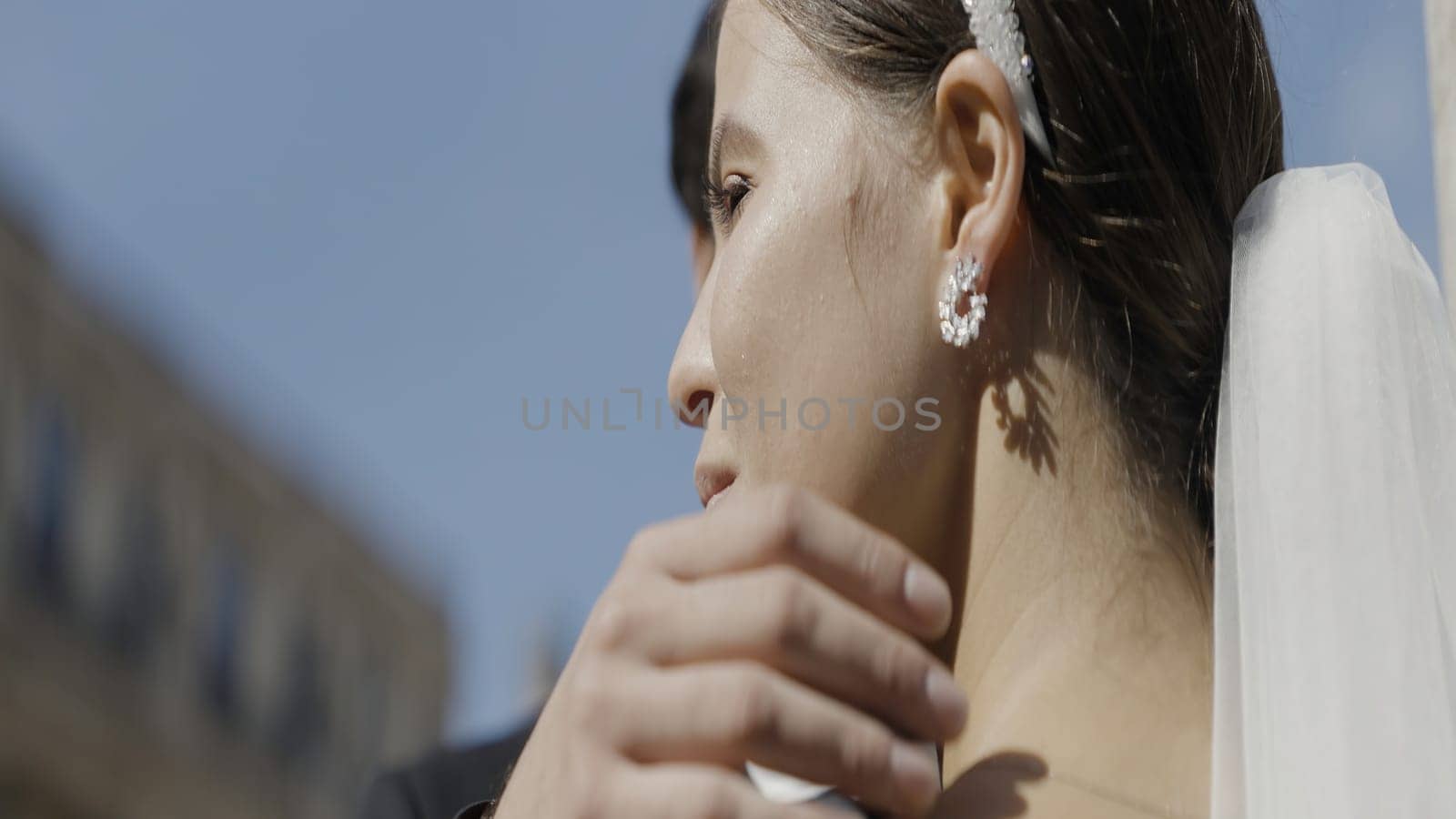 Embracing the bride and groom. Action. A happy smiling couple who are basking on an outdoor date. High quality 4k footage