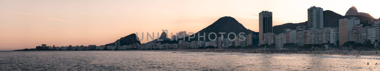 Golden Sunset Over Copacabana Beach and Christ the Redeemer by FerradalFCG