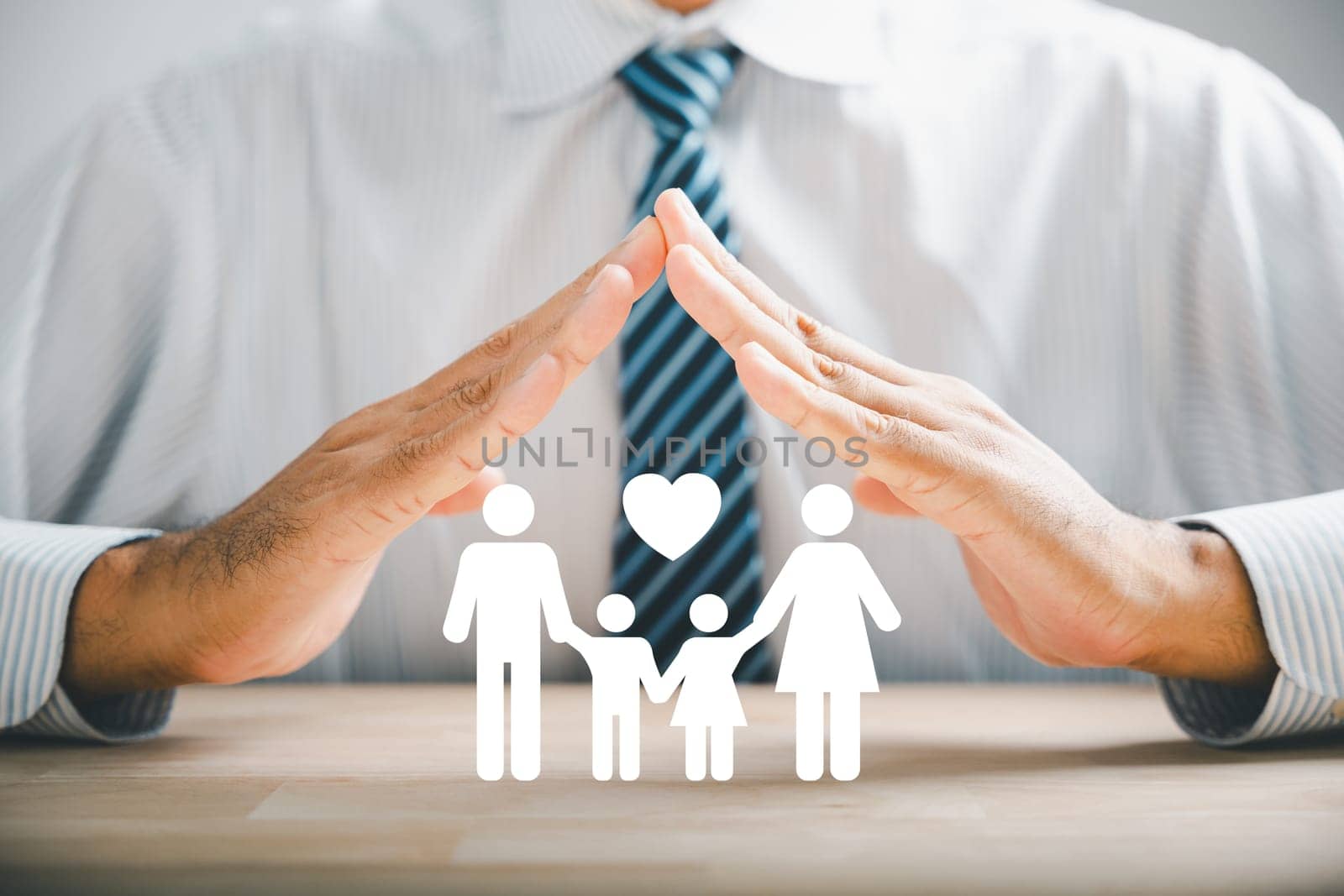 Hands with protective gesture and family by Sorapop