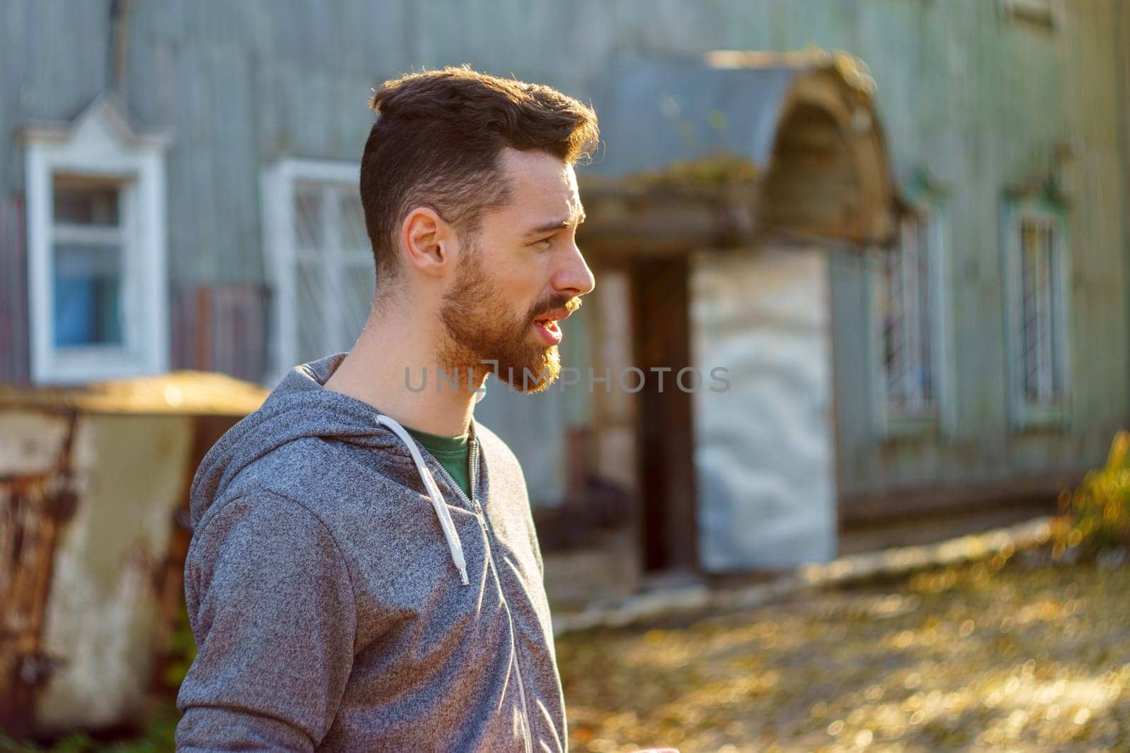 Stylish Man in a Grey Sweatshirt, portrait of a young millennial with a beard. by darksoul72