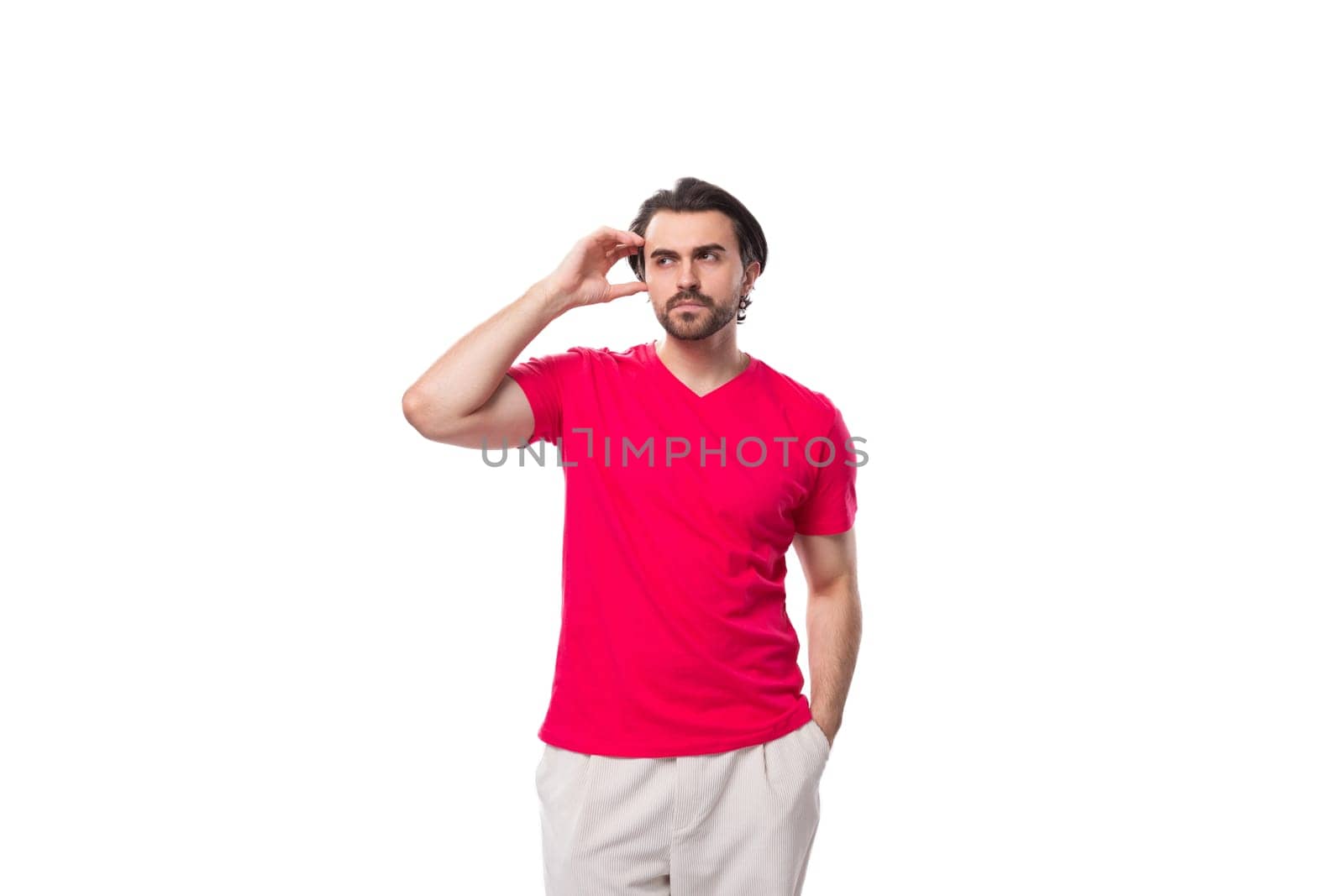 young man dressed in a red t-shirt with a mockup for an identity on a white background by TRMK