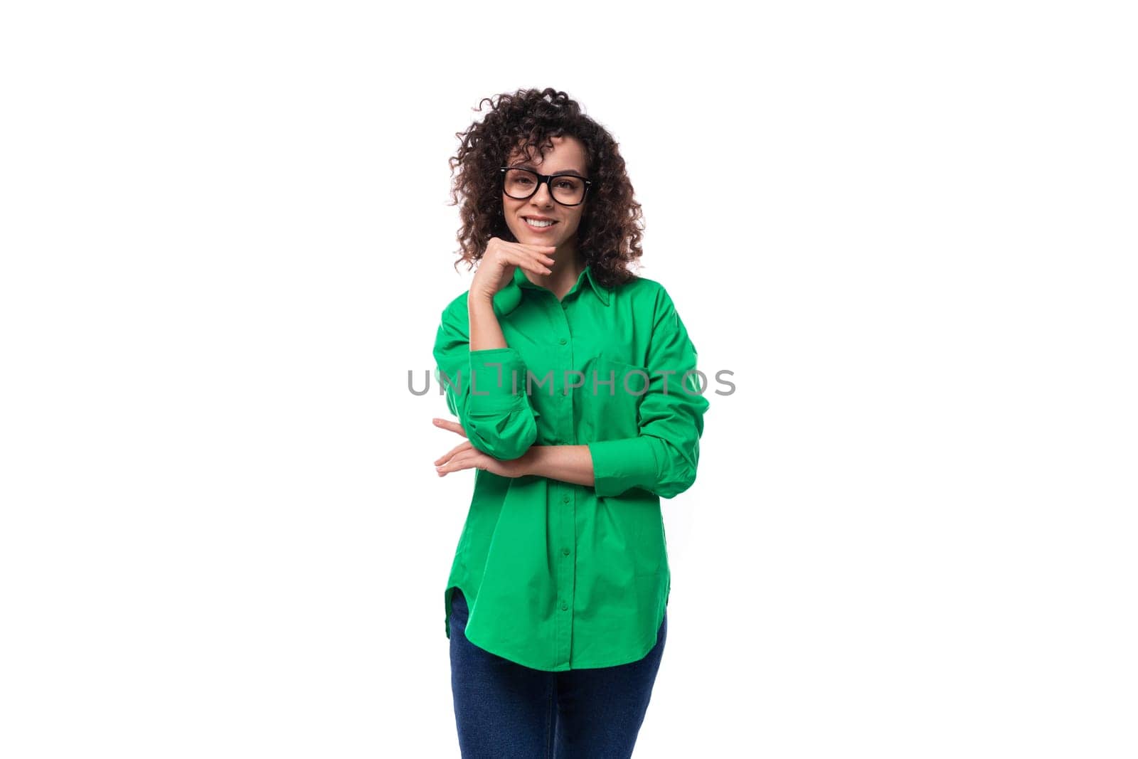 well-groomed young marketing employee woman in glasses dressed in a green blouse shows like by TRMK