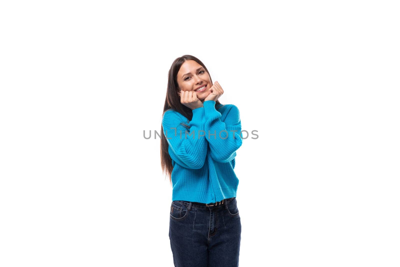 young beautiful european brunette woman dressed in a blue cardigan with buttons and v-neck by TRMK