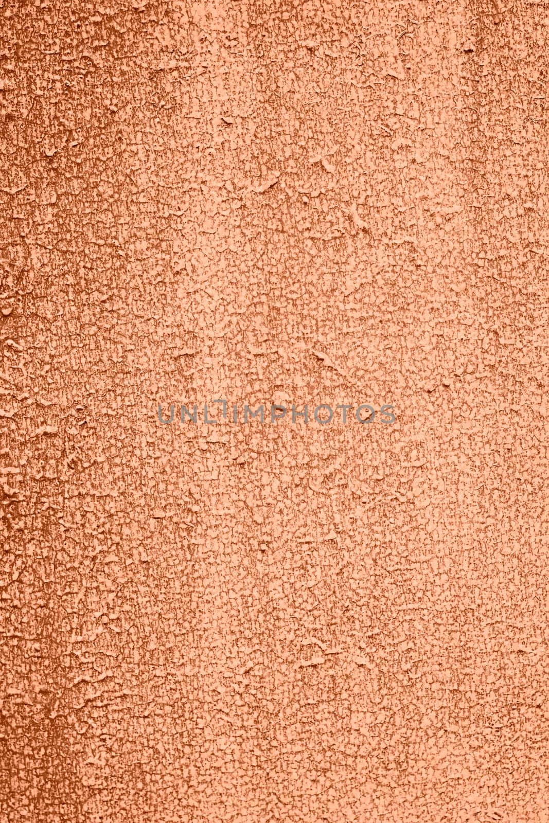 Peach Fuzz toned colour grunge decorative wall background. Art rough stylized texture banner trendy color 2024. Grunge Peach Fuzz color texture. High quality photo