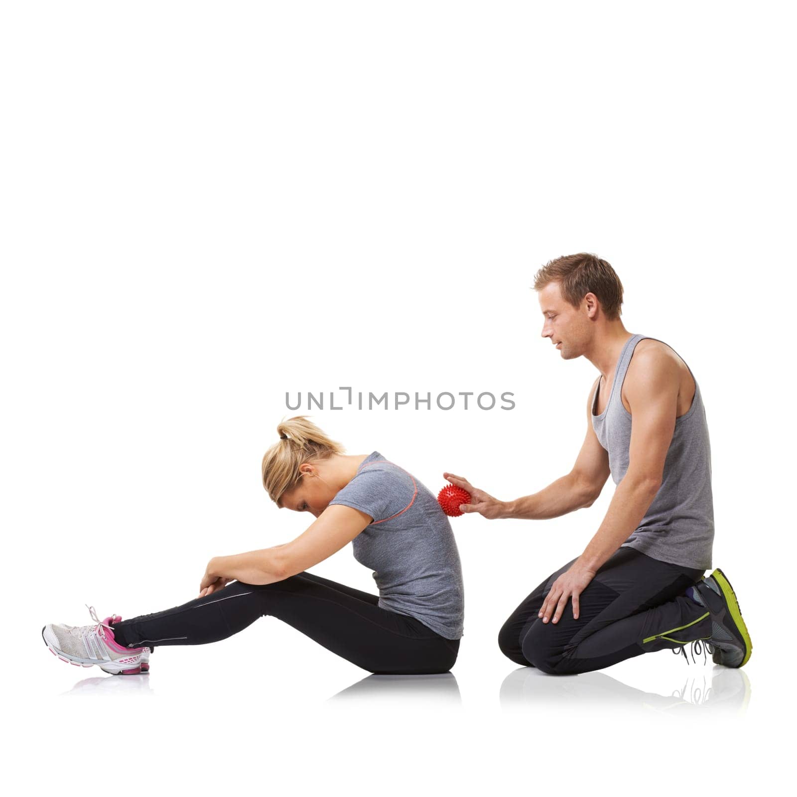 Massage ball, spine physiotherapy and woman in studio with sport, fitness and workout injury. Physical therapy, man and wellness with physio health and helping with white background and support.
