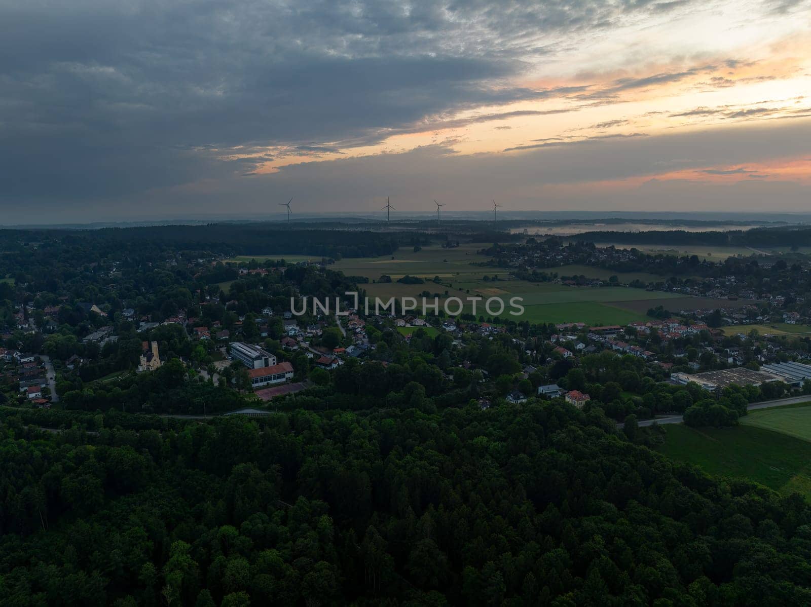 Aerial View of Town at Dawn with Wind Turbines by AllesSuper