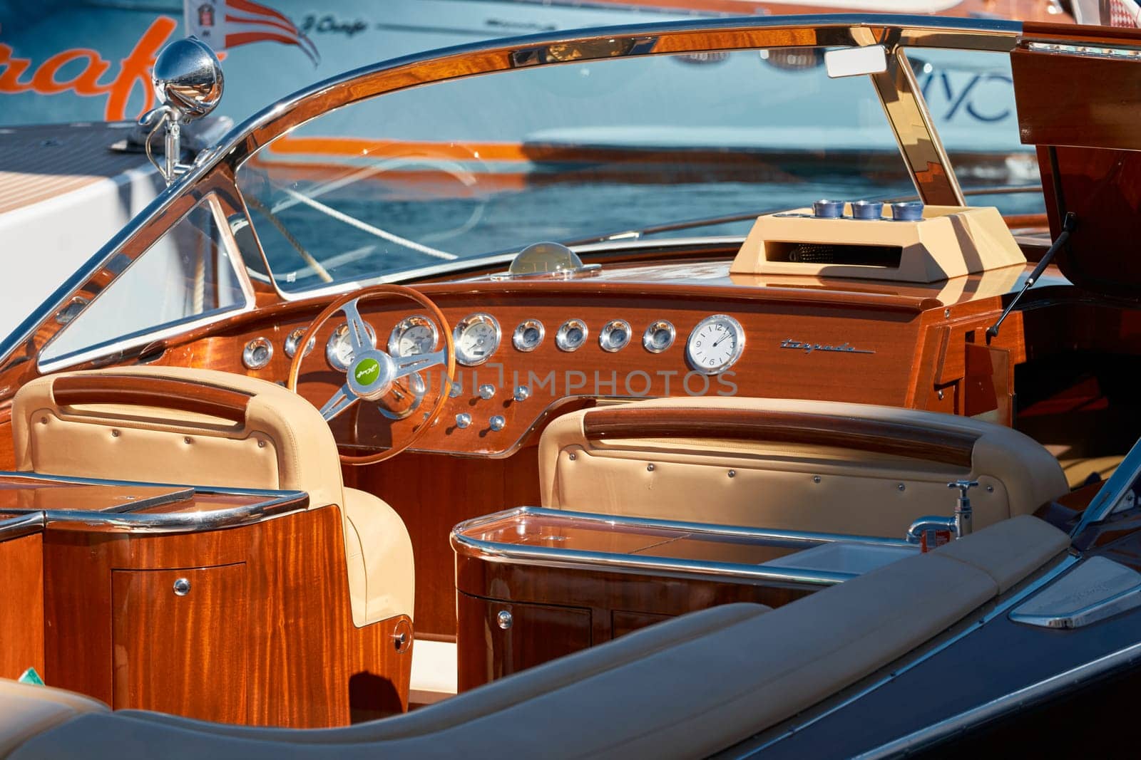 Monaco, Monte Carlo, 28 September 2022 - Interior of the luxury motor boat, port of Hercules in Monaco, sunny glare of the sun on the water, powerful boat, glossy surfaces shine in sunny weather. High quality photo