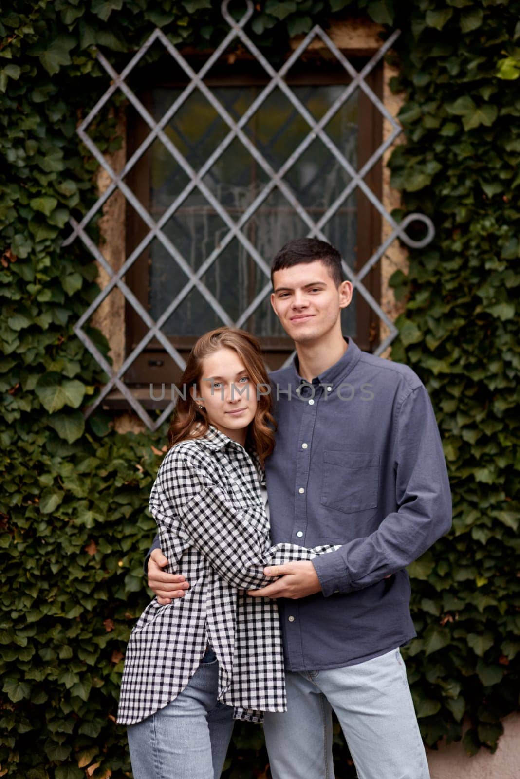 Young Cute Female Hugs Boyfriend. In Autumn Outdoor. Lovers Walking in Park. Attractive Funny Couple. Lovestory in Forest. Man and Woman. Cute Lovers in the Park. Family Concept. Happy Couple.