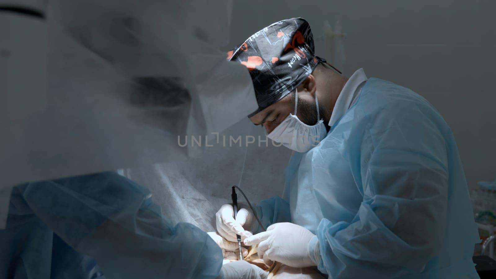 Team of doctors and surgeons processing surgical operation in operating room. Action. Modern hospital emergency department