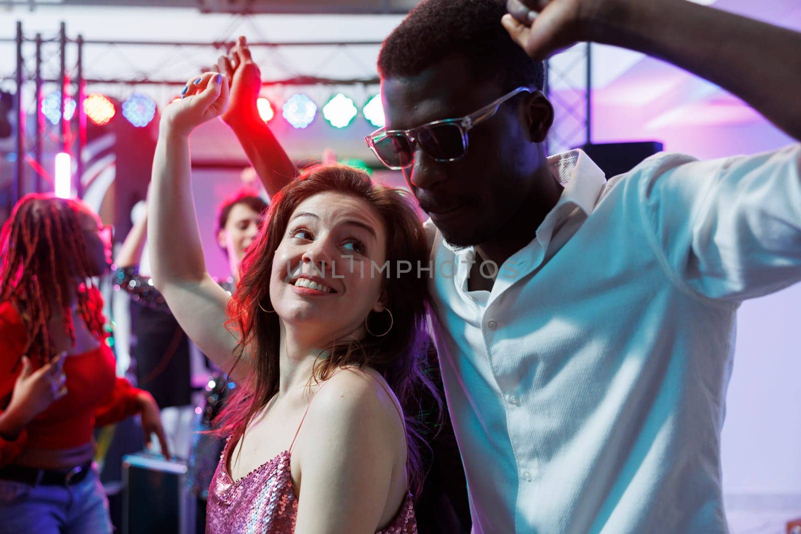 Romantic couple dancing in nightclub by DCStudio