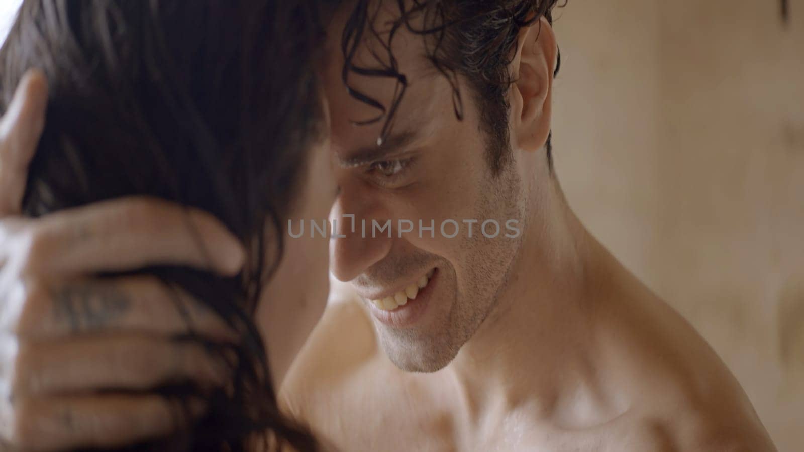 Passionate young sexy couple embracing naked with wet hair. Action. Loving man and woman together