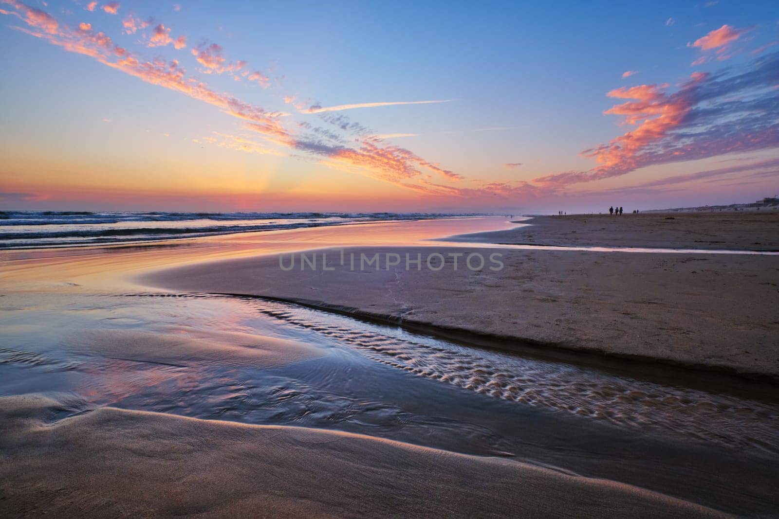 Atlantic ocean after sunset with surging waves at Fonte da Telha beach, Costa da Caparica, Portugal