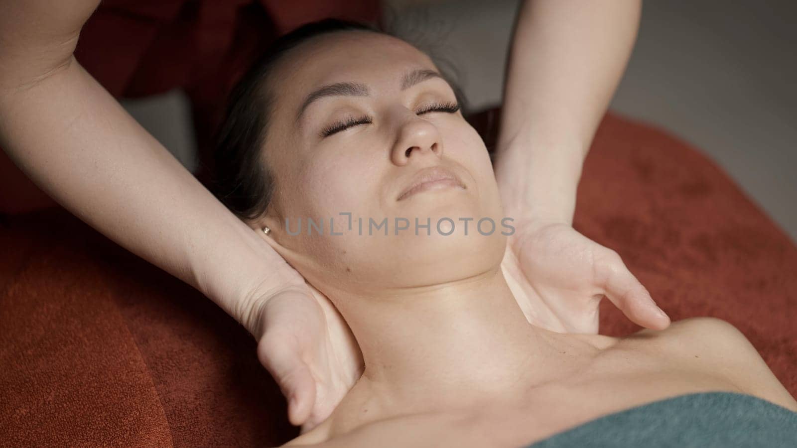 Full body massage.Action.A young girl who lies and a master who does a full body massage with oil. High quality 4k footage