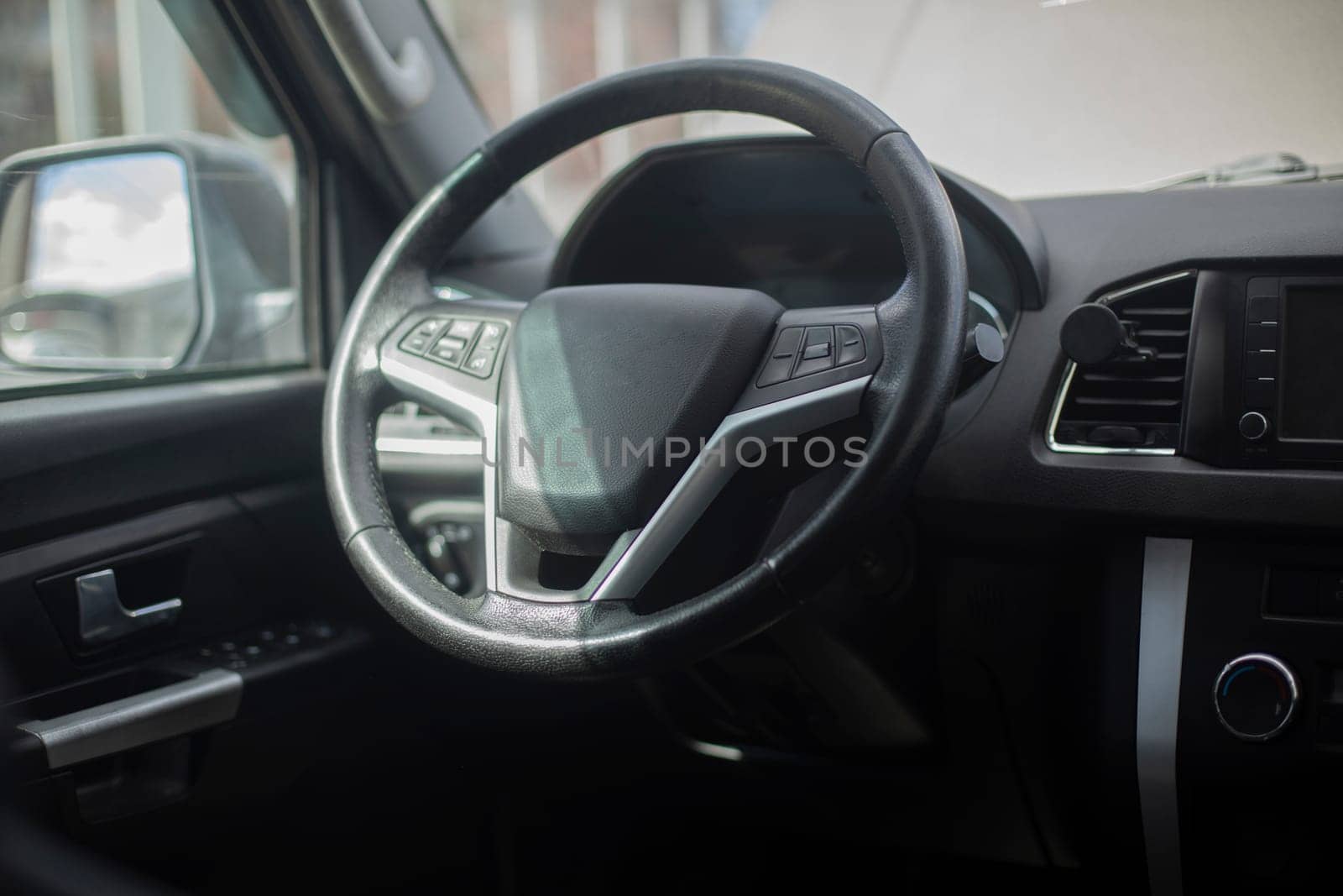 Wheel of car. Black Steering Wheel. Machine Interior Parts. Transport from inside.