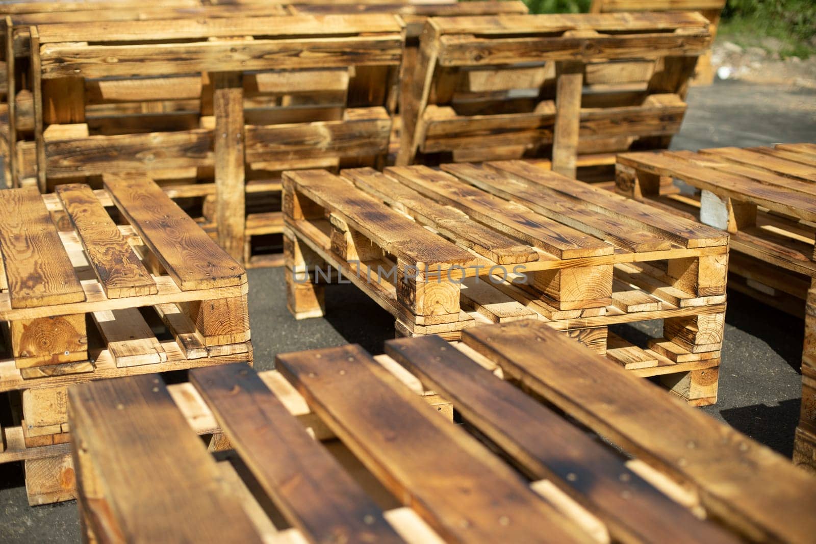Wooden pallets. Made of planks. Craft furniture. Raw board.
