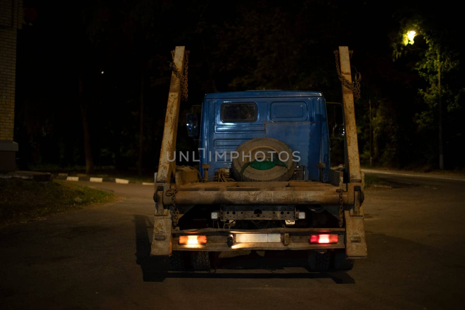 Truck in evening on road. Truck at night. Heavy transport. Pricea for evacuation.